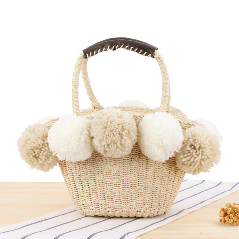 Basket bag with pompom decorated top edge Bowlift
