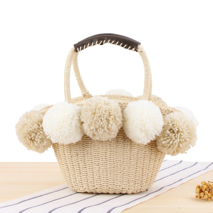 Basket bag with pompom decorated top edge Bowlift