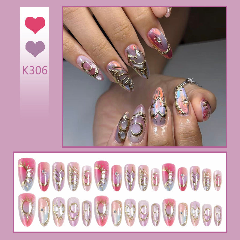 Acrylic nail set with glamorous 3D designs and elegant gold accents Bowlift