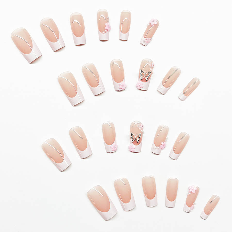 Artificial nail set with playful 3D flowers and glitter accents Bowlift