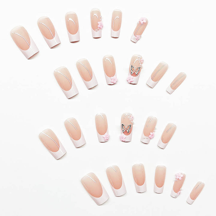 Artificial nail set with playful 3D flowers and glitter accents Bowlift