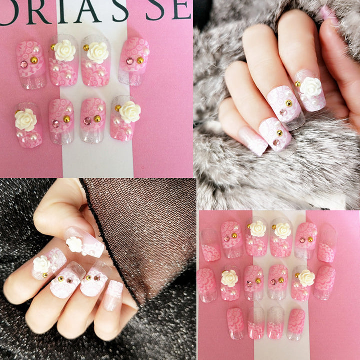 Artificials nails with sparkling rhinestone accents and elegant flower embellishments Bowlift