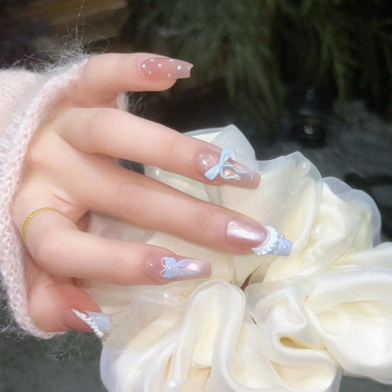 Art nail set with filigree bows and glitter accents Bowlift