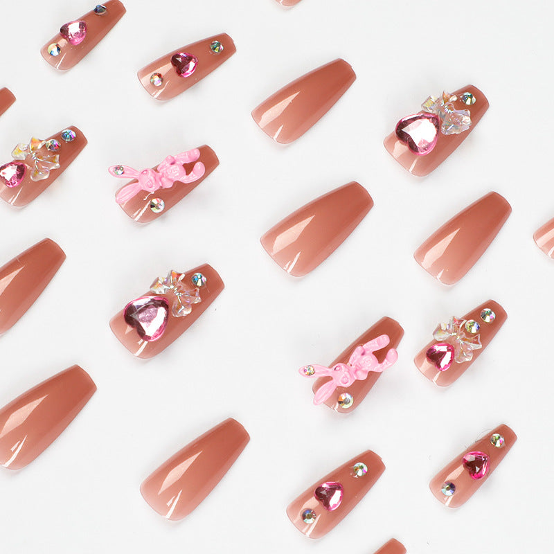 Artificial nail extensions with artistic decorations Bowlift
