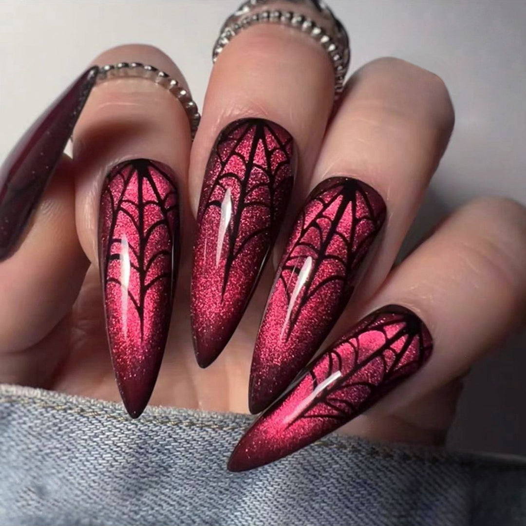 Creative Stiletto Nail Art with Blood Red Accents Bowlift