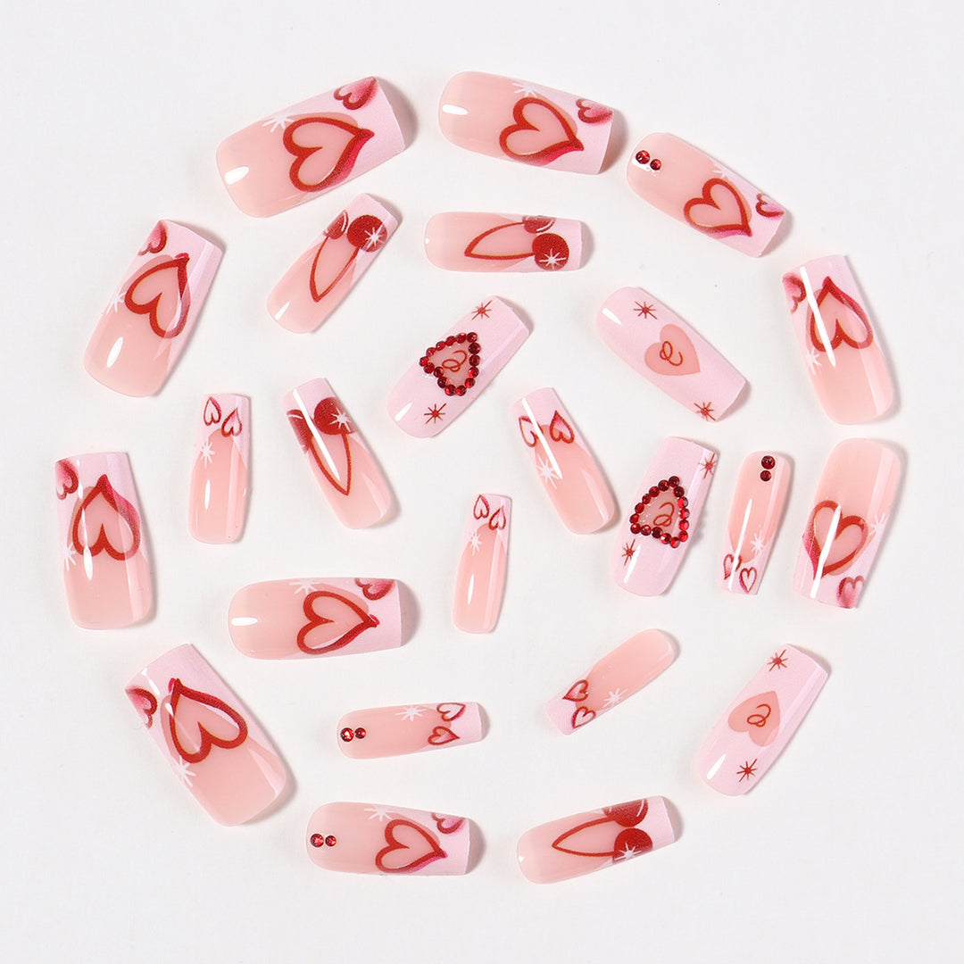 Artificial nail set with romantic heart designs and sparkling rhinestone decorations Bowlift