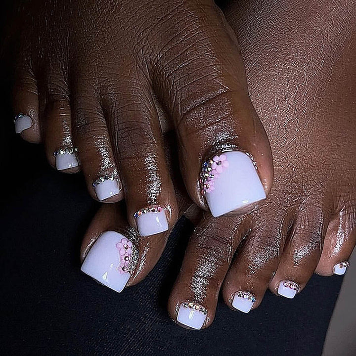 Nail art set with elegant glitter embellishments and floral accents Bowlift
