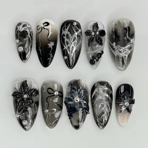 Elegant acrylic nail set with complex designs Bowlift