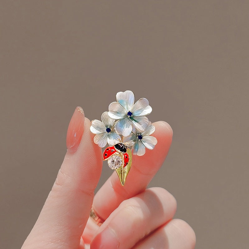 Flower brooch with ladybug and crystal Bowlift