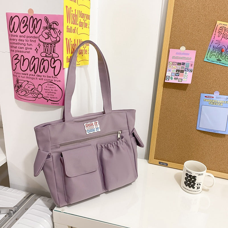 Tote bag with versatile compartments and ergonomic design Bowlift