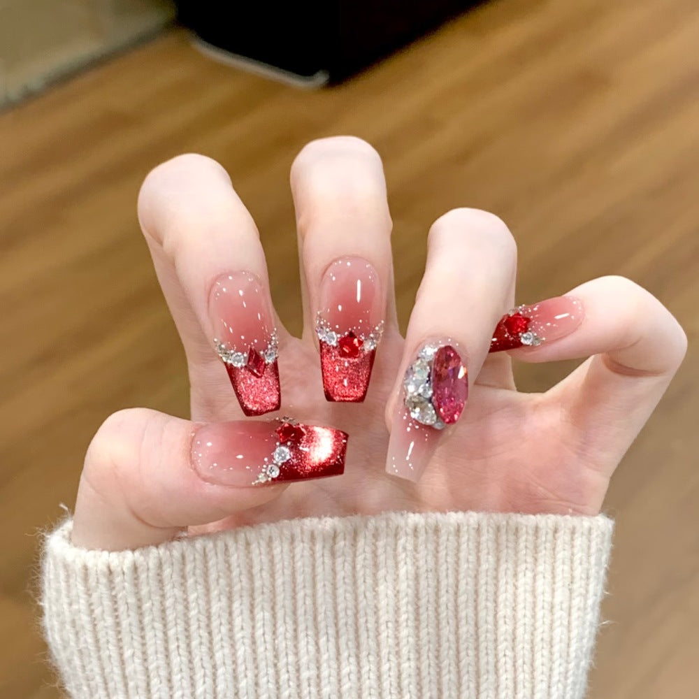 Glamorous artificial nails with sparkling rhinestone applications Bowlift
