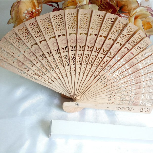 Ladies fan made of delicate plastic with artistic cut pattern Bowlift