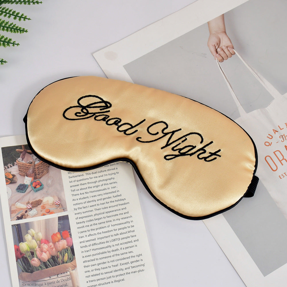Unisex embroidered contoured sleep mask with decorative text embroidery and adjustable elastic band Bowlift