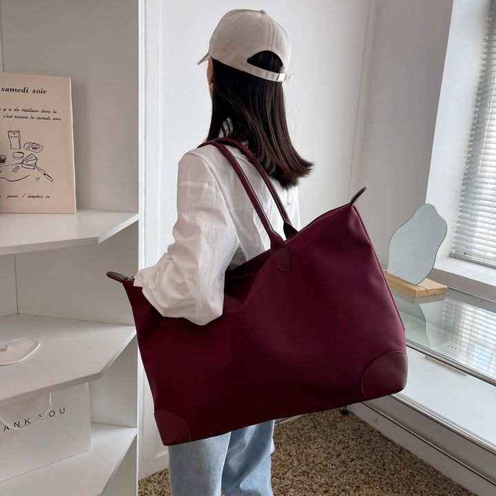 Large travel bag with durable material and multiple compartments Bowlift