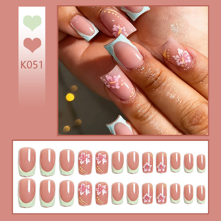 Artificial nail set with floral motifs and shiny accents Bowlift
