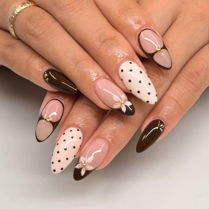 Artful nail design with floral and dot motifs Bowlift