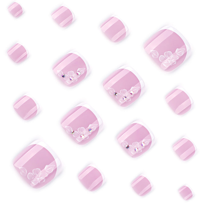 Artful toenail design with delicate flowers and glitter embellishment Bowlift