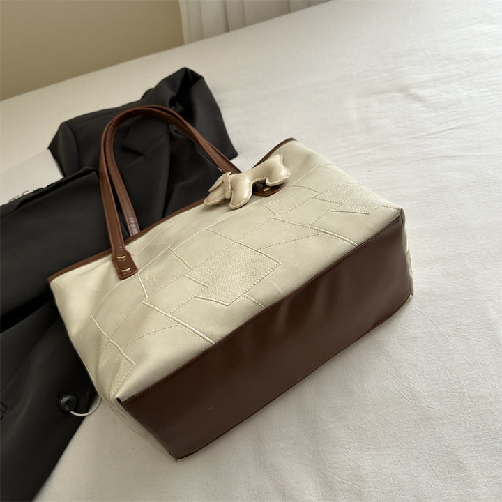 Stylish Textured Tote Bag with Decorative Charm