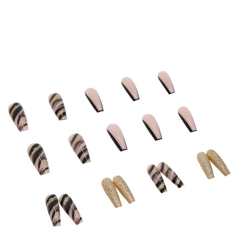 Acrylic nail set with luxurious golden accents and elegant designs Bowlift