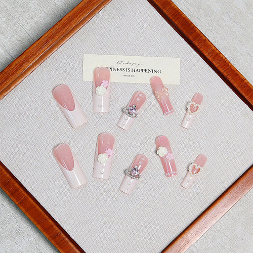 Artful nail tips with pearl and bow motifs Bowlift