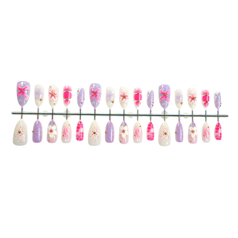 Artificial nail set with floral decorations and delicate glitter Bowlift