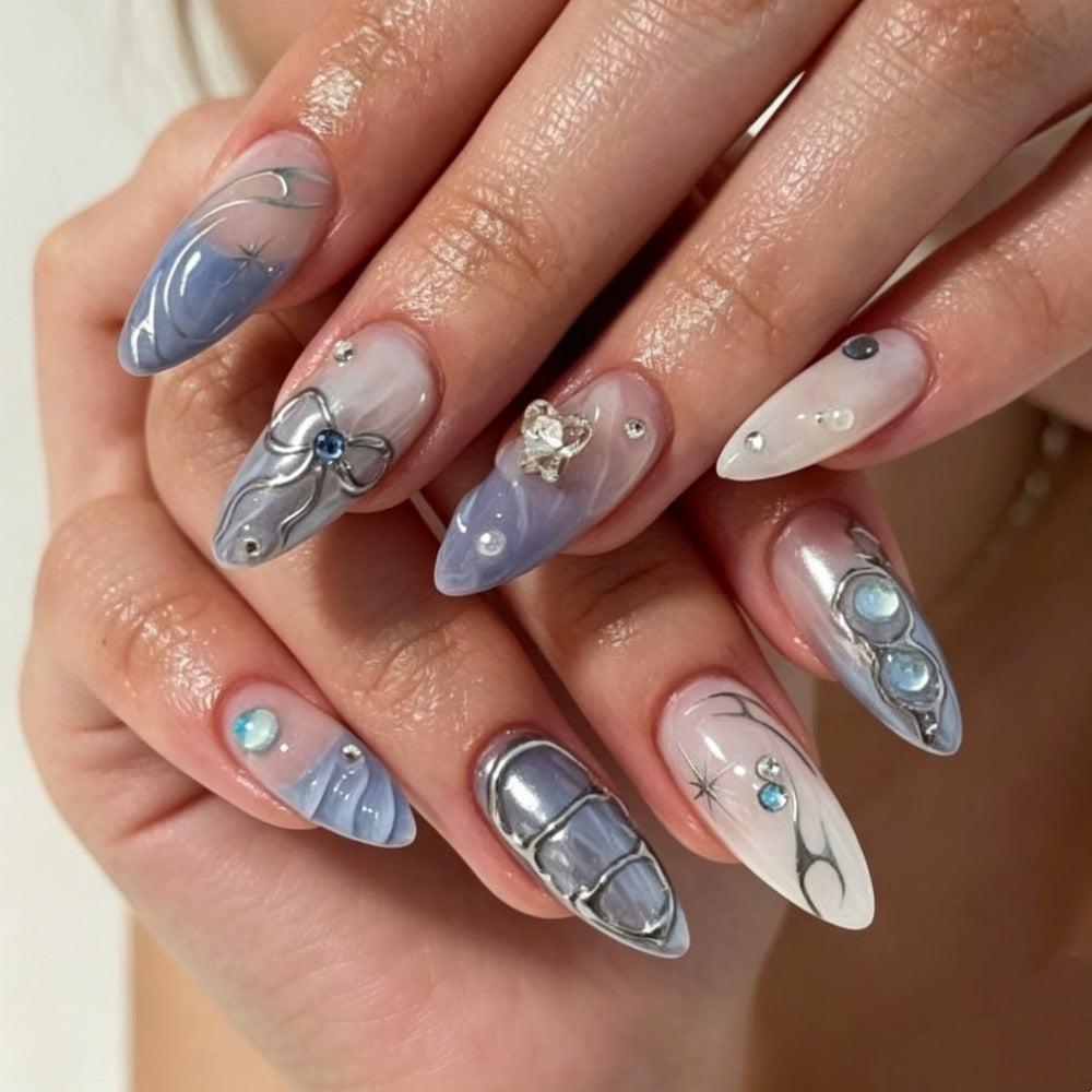 Artistic Press-On Nail Design with Floral and Gem Accents Bowlift