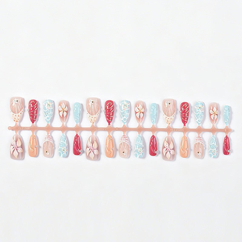 Artificial nail set with floral 3D design and glitter accents Bowlift