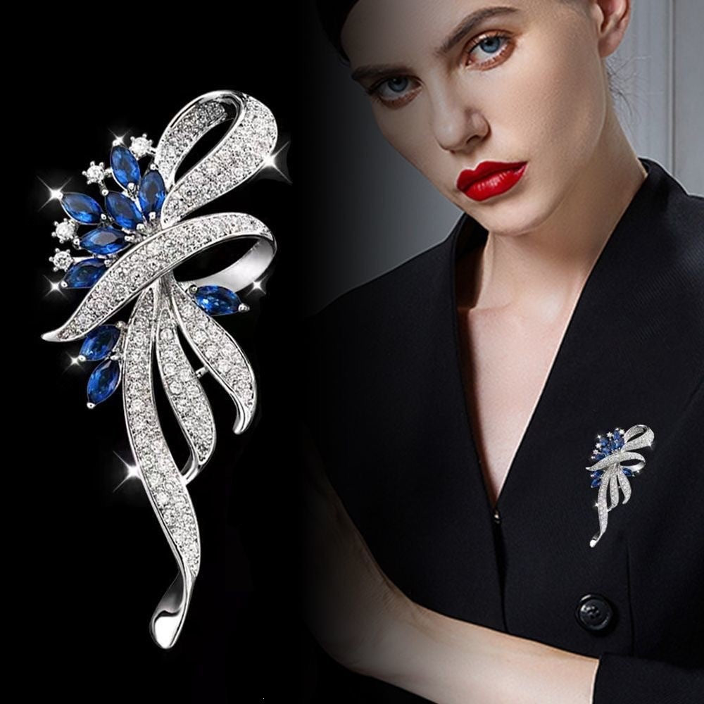Exquisite brooch with sparkling zirconia and blue gemstones Bowlift