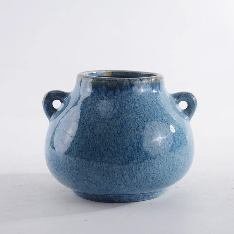 Decorative ceramic pot with playful handles Bowlift