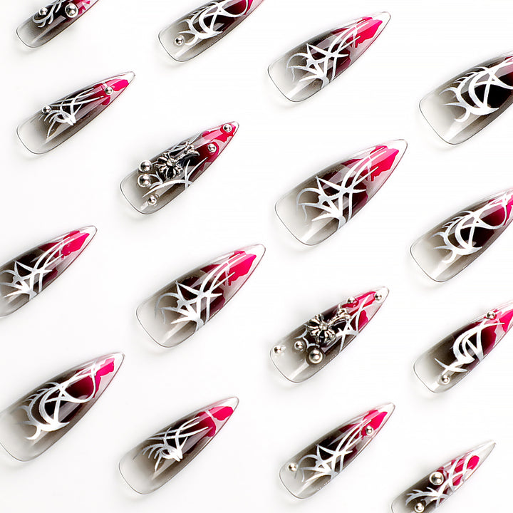 Artful stiletto nails with elegant decoration and modern accents Bowlift