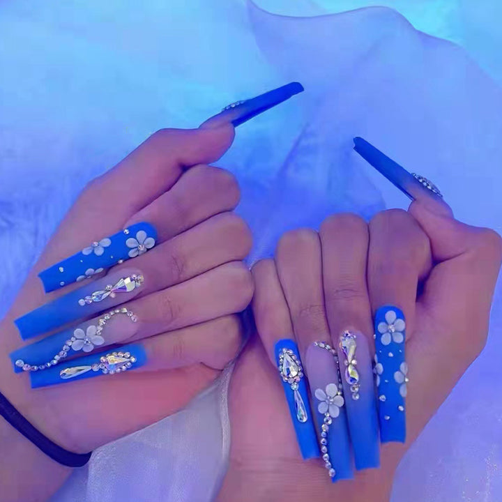 Nail art set with elegant 3D flower designs and glitter accents Bowlift