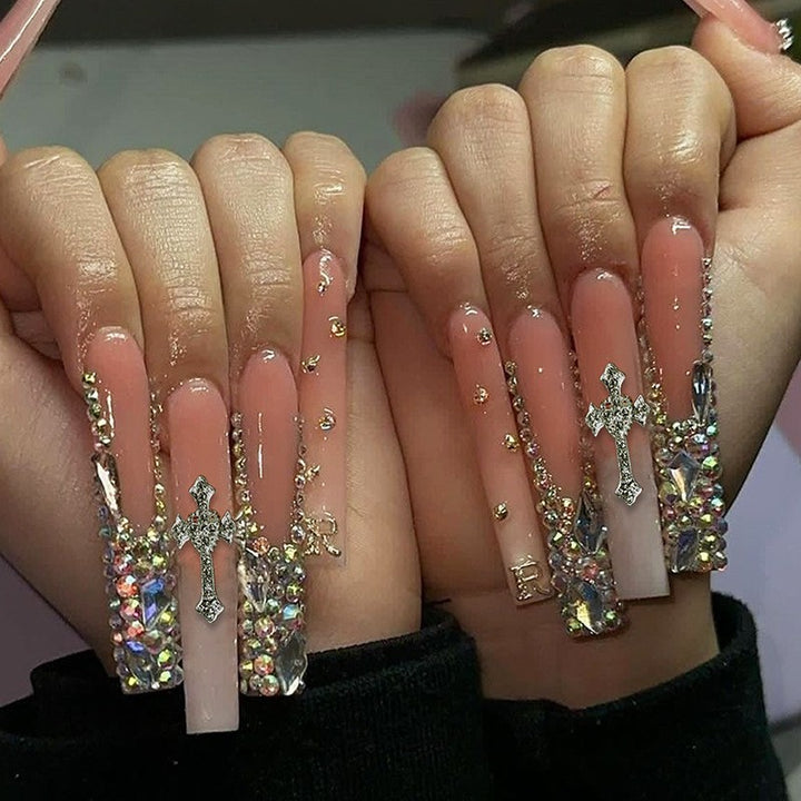 Glamorous artificial nail set with sparkling rhinestones and cross decorations Bowlift