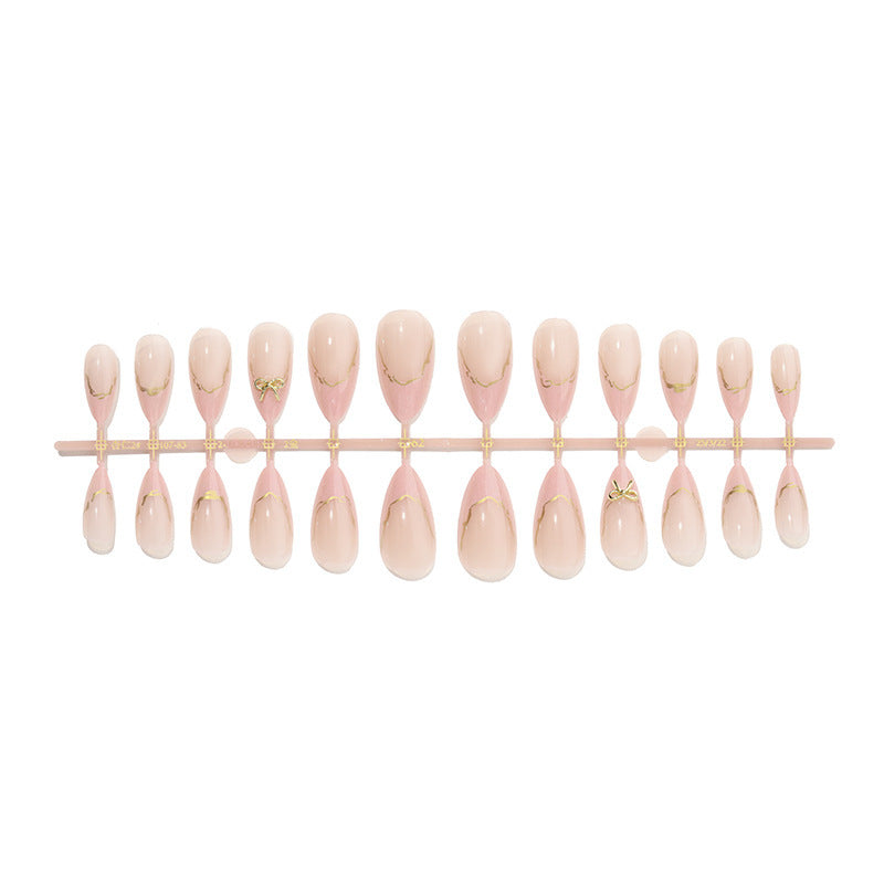 Artificial nail set with delicate bows and golden accents Bowlift