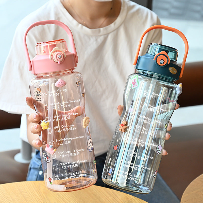 Women’s water bottle with integrated time marking and practical carrying handle Bowlift