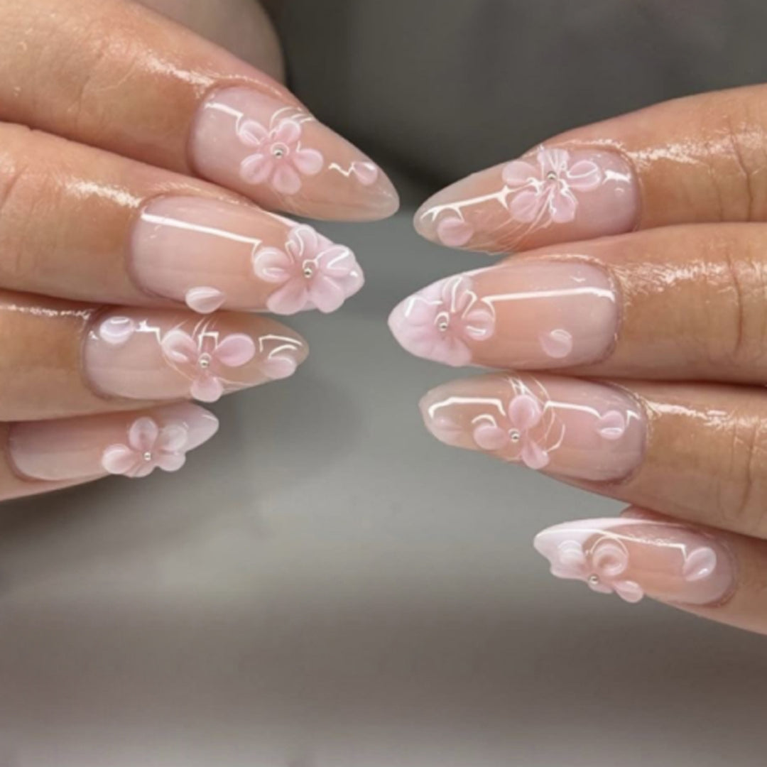Artful stiletto nails with elegant floral design and glitter details Bowlift