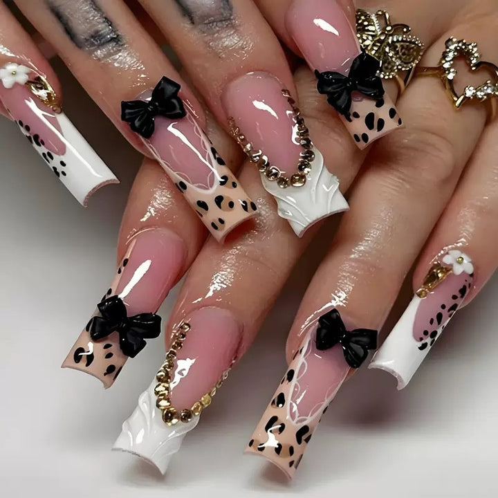 Artistic Press-On Nail Design with Bow and Animal Print Accents Bowlift