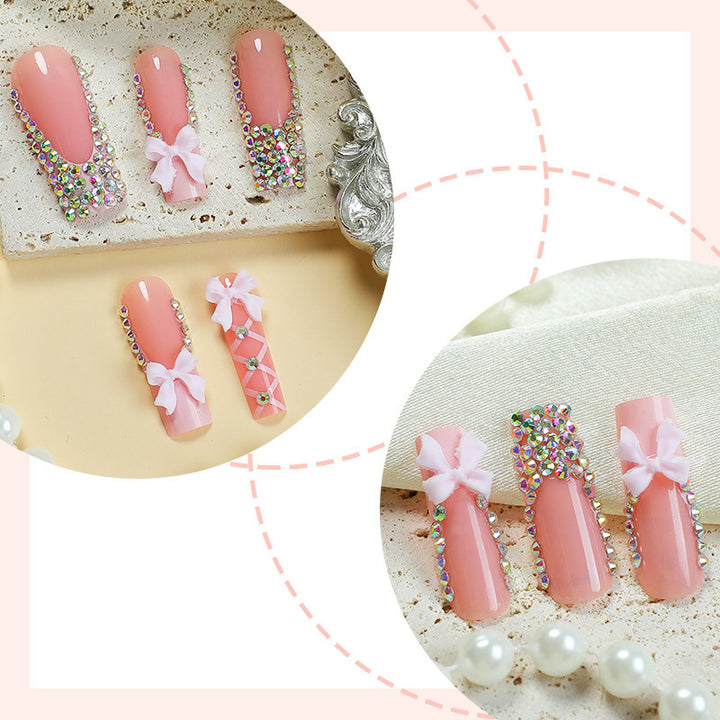 Acrylic nail set with luxurious rhinestone embellishments and bow accents Bowlift