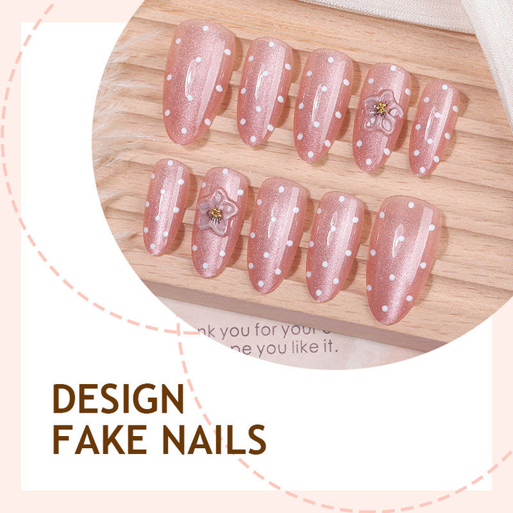 Artificial nail set with glitter and delicate floral and rhinestone embellishments Bowlift