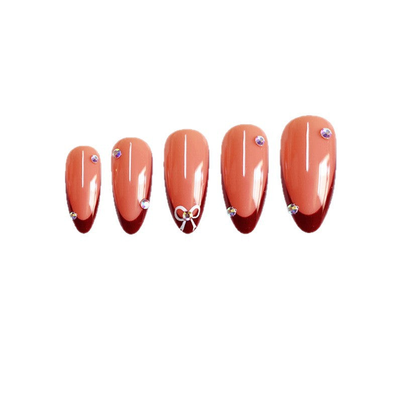 Artistic Stiletto Press-On Nails with Gemstone Accents Bowlift