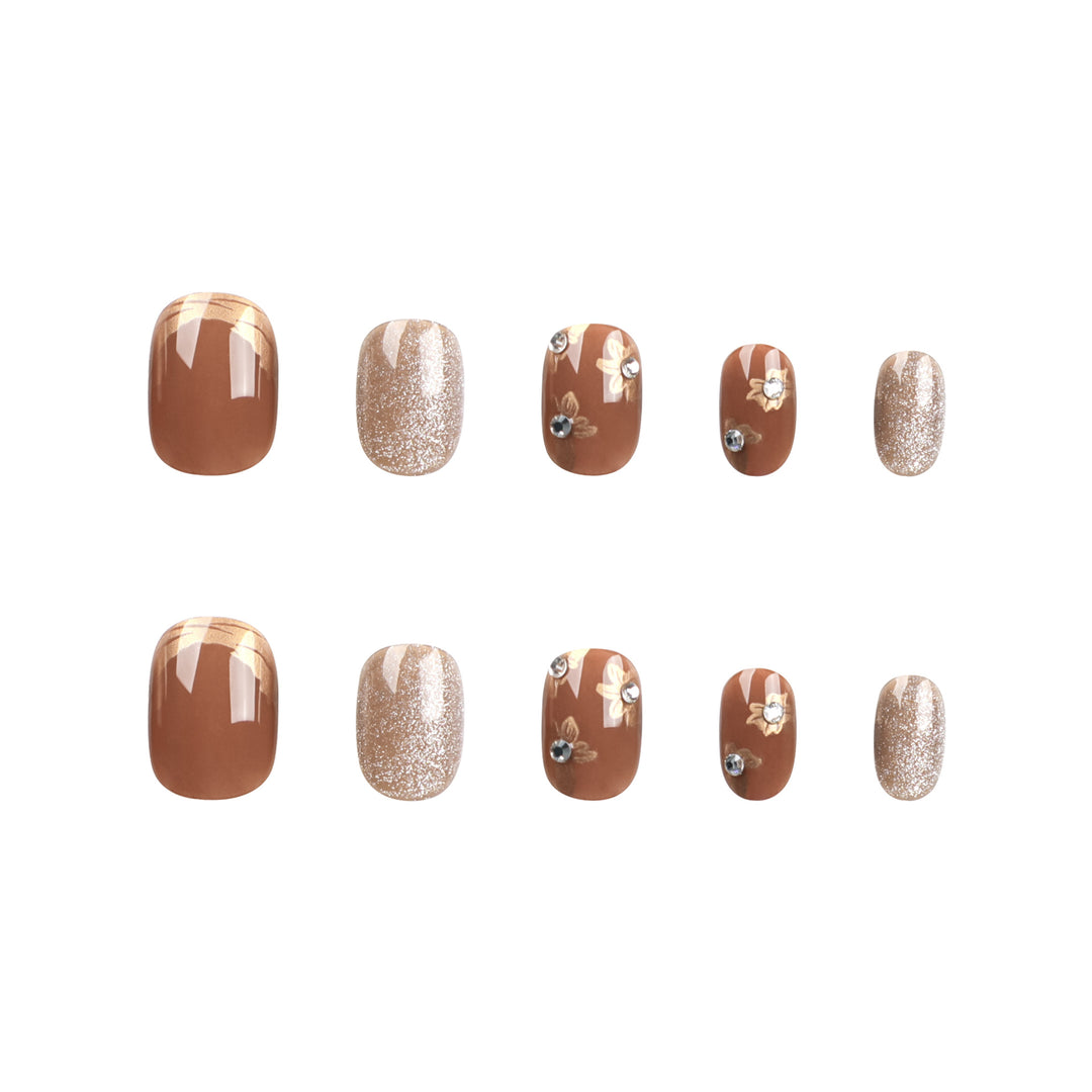 Elegant Nail Decoration with Glitter and Floral Accents Bowlift