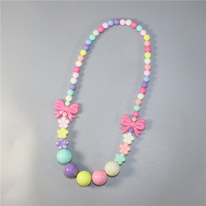 Colorful pearl necklace with floral elements Bowlift