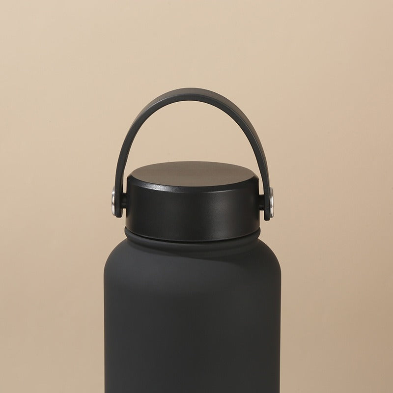 Women's double-walled insulated water bottle with practical carrying handle Bowlift