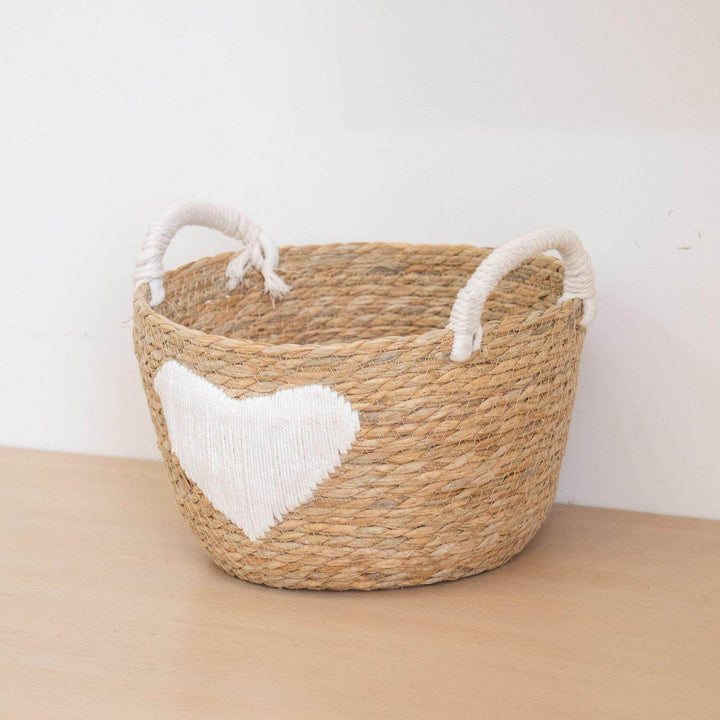 Handwoven storage basket with heart design Bowlift