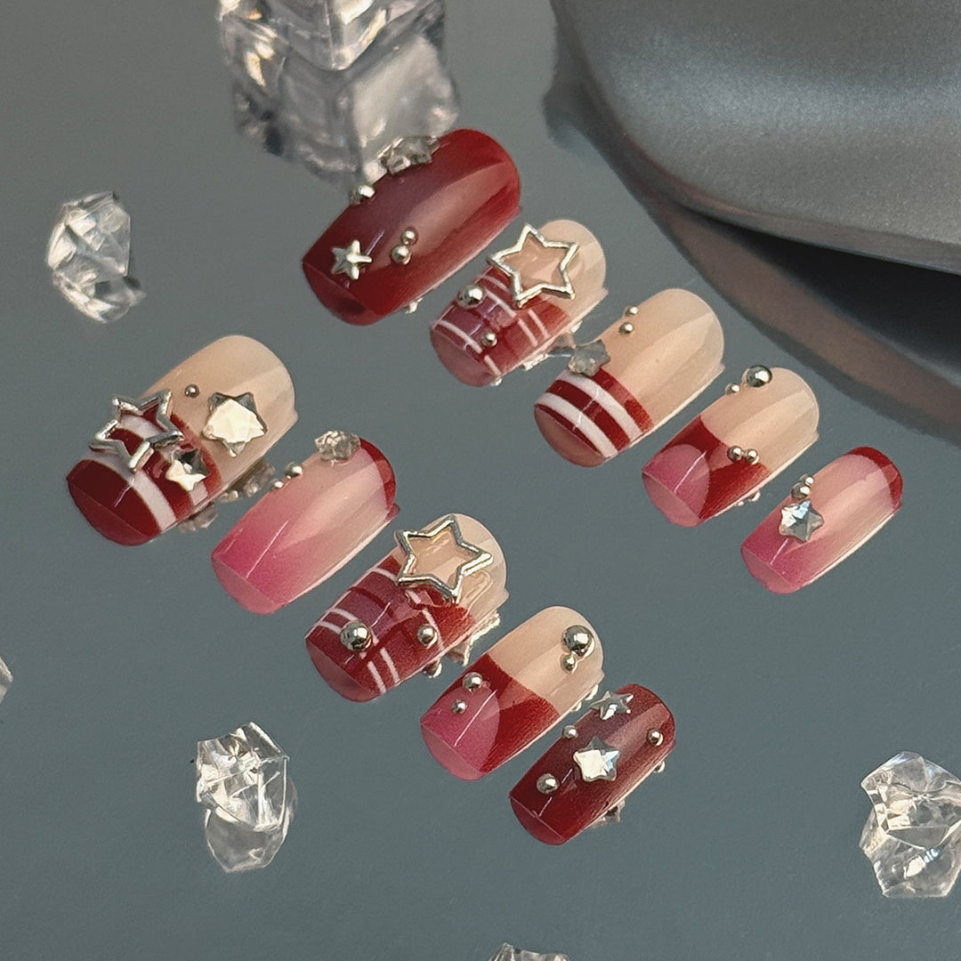 Artificial fingernails with handcrafted star decorations Bowlift