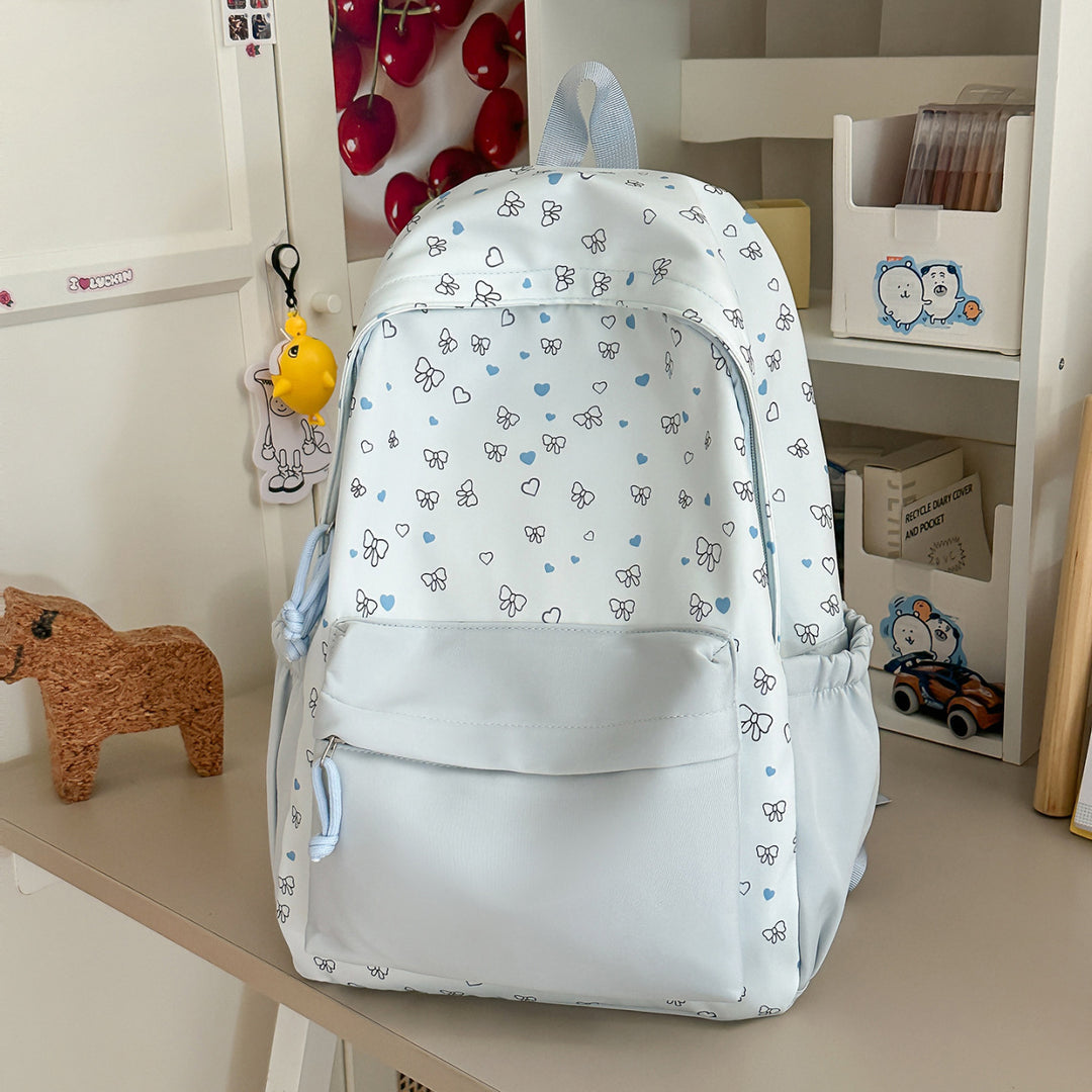 Playful Heart and Bow Patterned Backpack