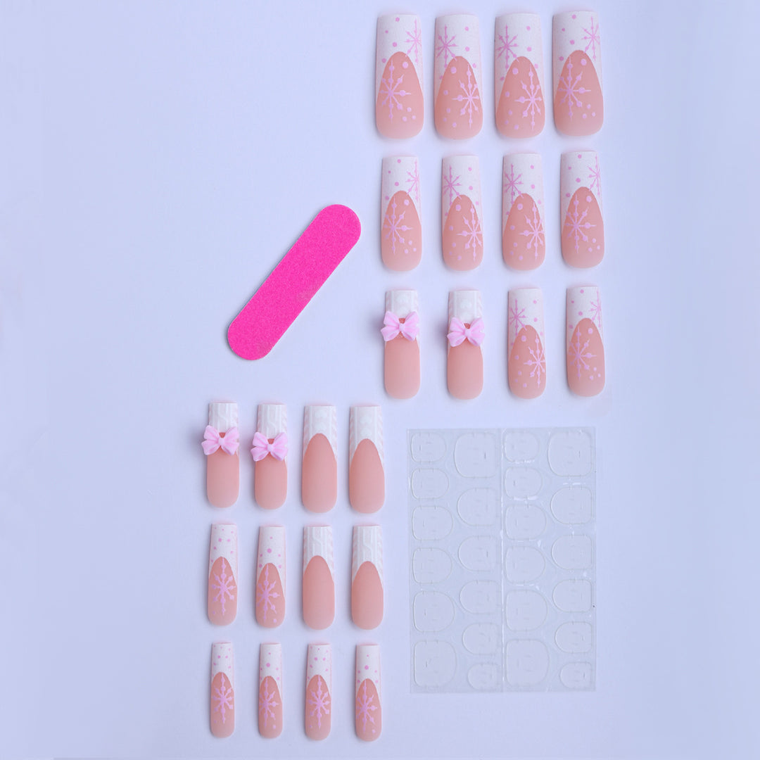 Artificial nail tips with playful bows and snowflake design Bowlift