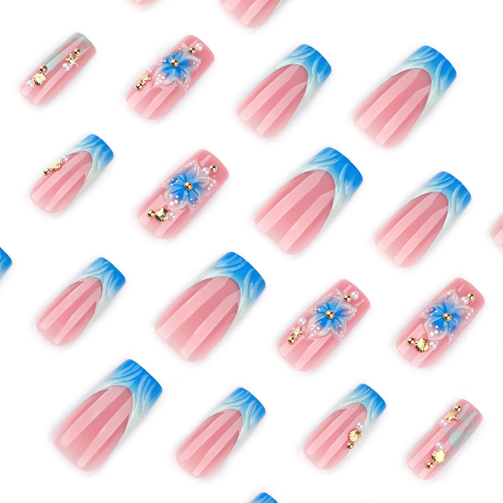 Artful nail art with floral accents and glitter effects Bowlift