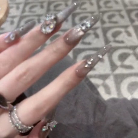 Glamorous artificial nails with rhinestone accents Bowlift