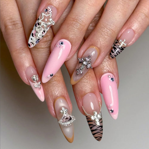 Artful stiletto nails with glitter and rhinestone embellishments Bowlift