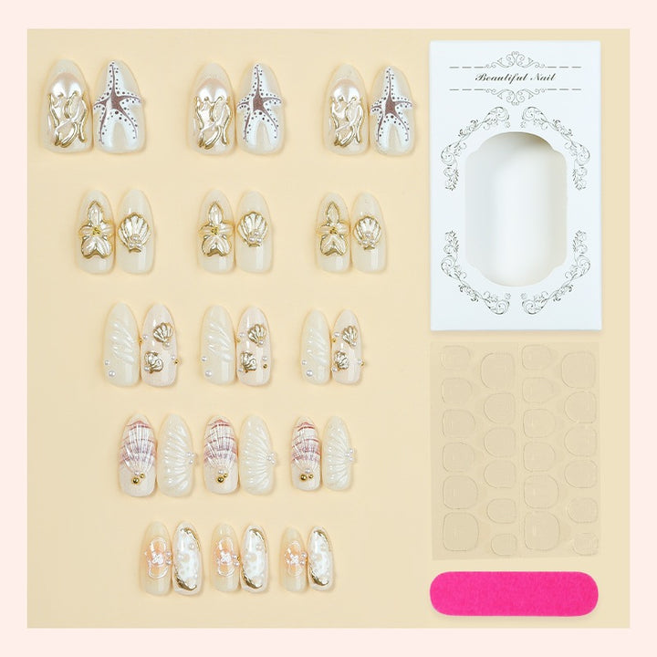 luxurious artificial nail set with maritime designs and golden accents Bowlift